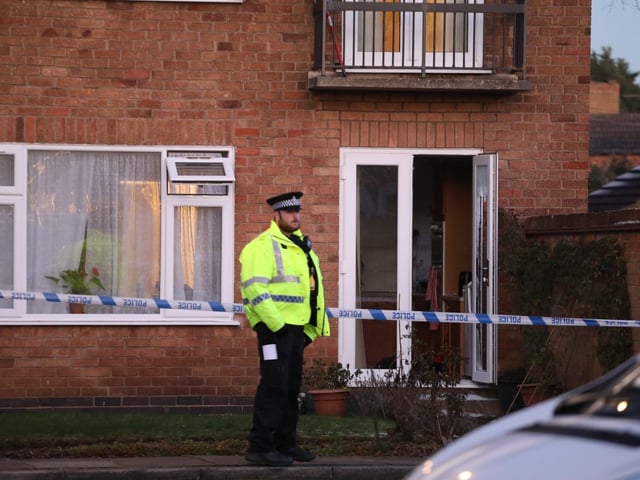 An officer at the murder scene