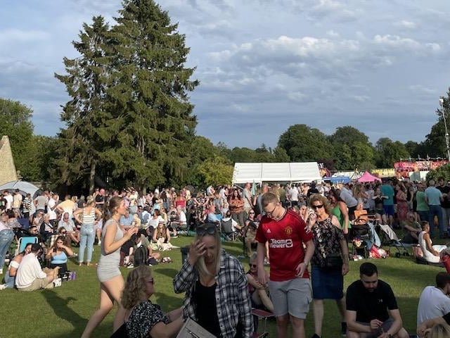 Crowds resist the rain and descend on Hall Park to enjoy the day.