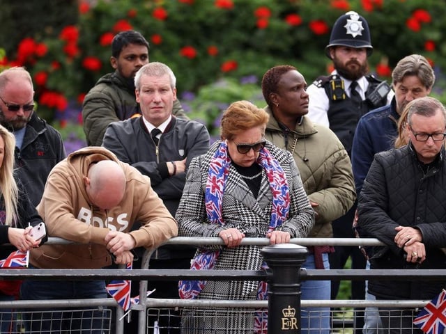 Mourners pay their respects as Queen Elizabeth II's coffin passes on its way to Weestminster Abbey