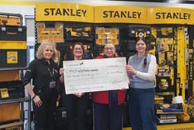 Charity cheque presentation to MNDA by sara Homer and Charlotte Patrick of Brackmills BID