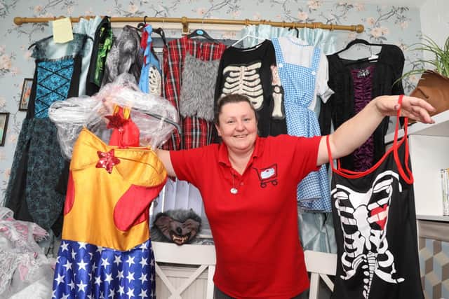 Kelly Mercer with some of the costumes that can be hired for £2