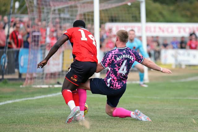 Michael Gyasi is caught late by Peterborough Sports' Joe Burgess, but the referee did not award a penalty (Picture: Peter Short)
