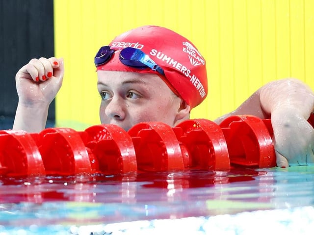 Maisie Summers-Newton celebrates winning the gold medal in the Women's 100m Breaststroke SB6 Final in Birmingham