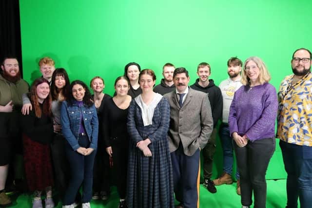 Group photo of student, staff and actors at the University of Northampton.