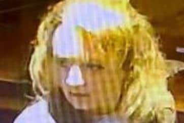 Police want to speak to this woman about the theft in the Corby Candle