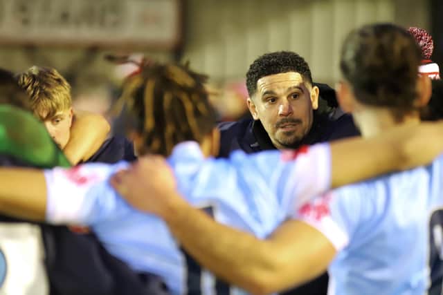 Liam McDonald speaks to his players in the team huddle after Saturday's win (Picture: Peter Short)