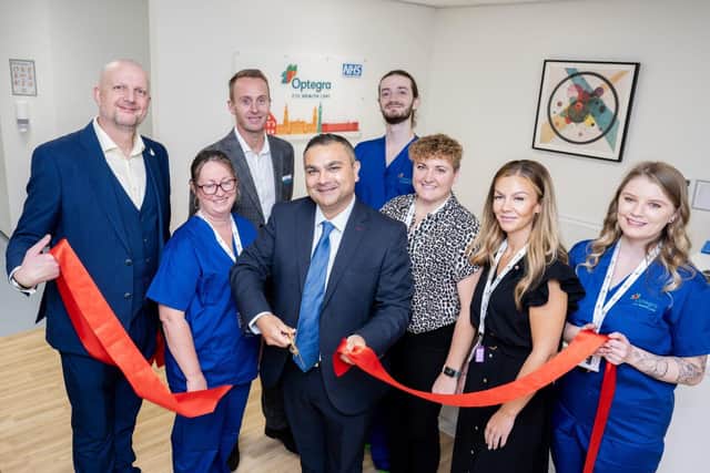 Leicester MP Peter Bedford cuts the ribbon
