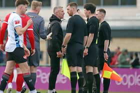Kettering Town boss Richard Lavery chats to referee Will Murray at the end of Saturday's game (Picture: Peter Short)