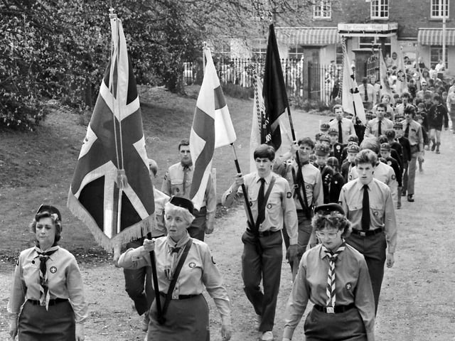 Kettering 1987 the annual St George’s Day parade walks up the drive of the parish church - St Peter & St Paul