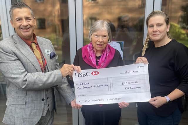 Cathy Fountain hands over charity cheque