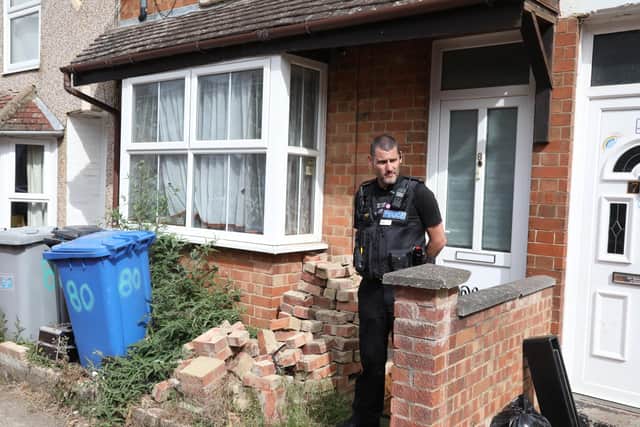 A house remains sealed further along the street