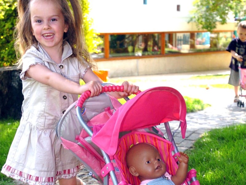 Eden Braybrook, 4, with toys donated by Zapf Creations.