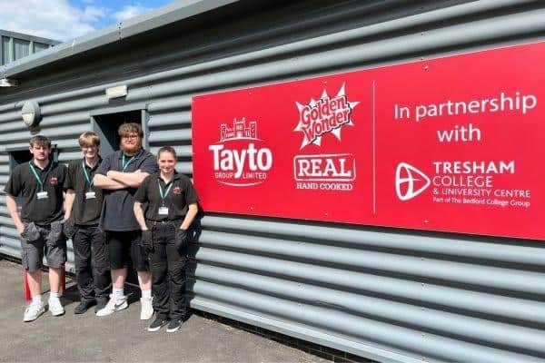 Tresham College apprentices outside Tayto Factory in Corby, where they successfully refurbished a set of control panels as part of their engineering training.