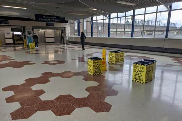 The leak in the roof of the bridge connecting Swansgate to the multi-story car park has persisted for well over a year