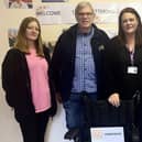 Emma, Kaysha and Sharon with Al and the donated wheelchair at our day centre in Kettering