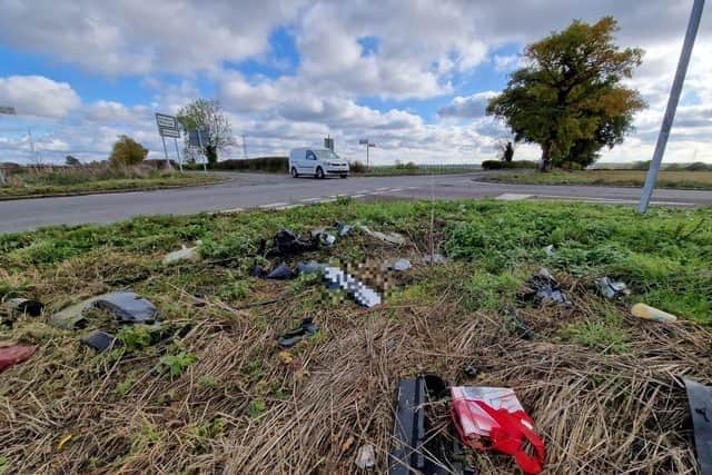 Debris from crashes at the site strewn in a nearby field