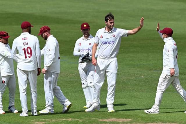 Matt Kelly is congratulated after taking the wicket of Ollie Robinson