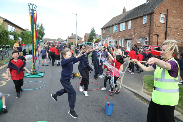 Pupils from Grange Primary Academy play in the street