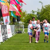 A team crossing the finish line at the 2023 Oundle triathlon