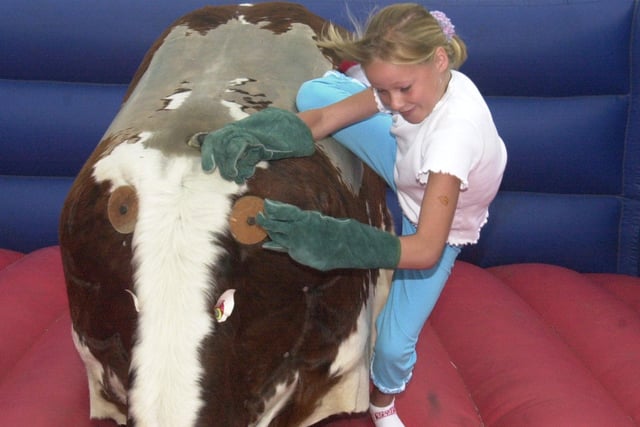 Pictured at the Bradgate Park Golden Jubilee Gala in Rotherham on Aug 19 2002, Laura Hartshron  tries her luck on the bucking bronco