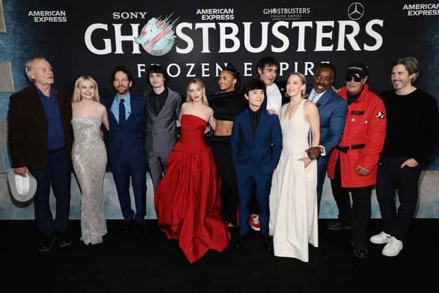 (L-R) Bill Murray, Emily Alyn Lind, Paul Rudd, Finn Wolfhard, Mckenna Grace, Celeste O'Connor, Logan Kim, Gil Kenan, Carrie Coon, Ernie Hudson, Dan Aykroyd and Jason Reitman attend the premiere of "Ghostbusters: Frozen Empire" at AMC Lincoln Square Theater on March 14, 2024 in New York City. (Photo by Dimitrios Kambouris/Getty Images)