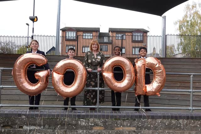 Head Teacher Emma Johnson and pupils celebrate their 'good' report