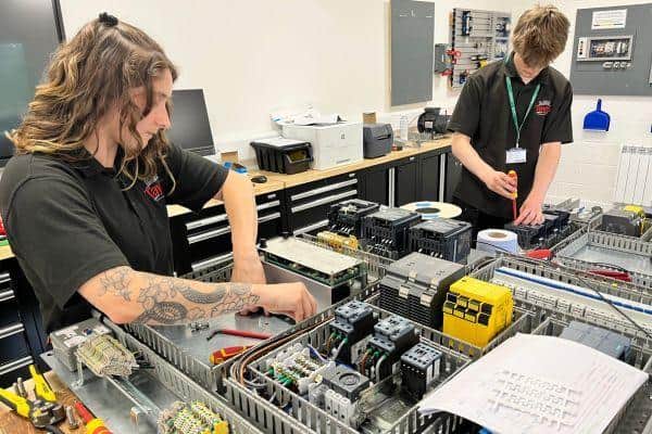 Putting skills into action – Tresham College apprentices refurbish control panels for Tayto Factory.