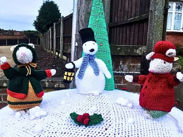 Rushden Yarn Bombers have decorated the town's post boxes with festive toppers