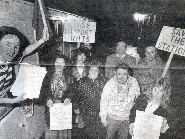 Frances Mackness holds up a petition calling for Rushden Train Station to be saved from demolition watched by members of the Save Rushden Rail Station committee in October 1990