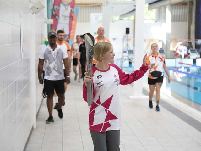 Rebecca Johnson waves to the crowd