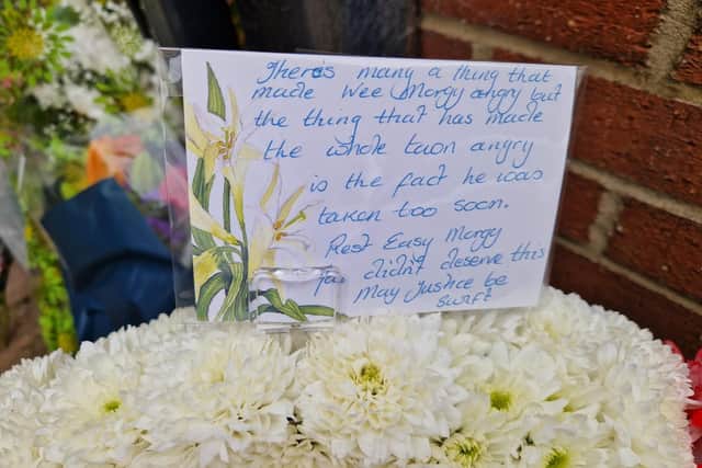 A message left on a wreath placed by Raunds traders and friends of David Morgan/National World
