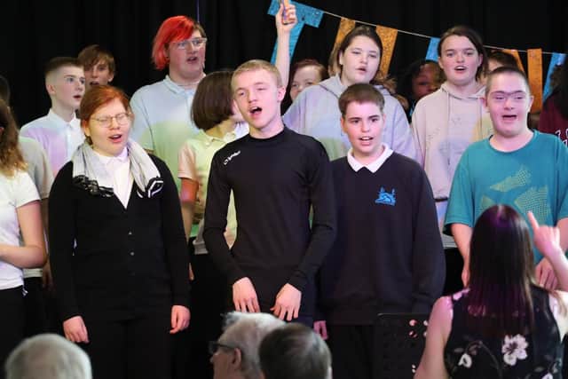 Isebrook School's Voice In A Million Choir entertain the guests with a concert.