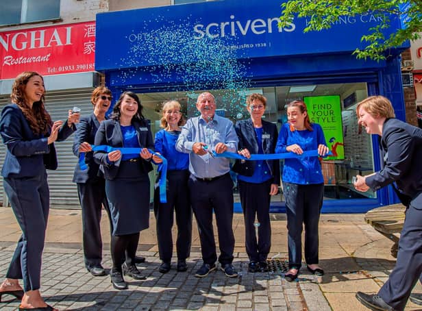 Loyal customer Brian Hill cuts ribbon to launch Scrivens Opticians Rushden