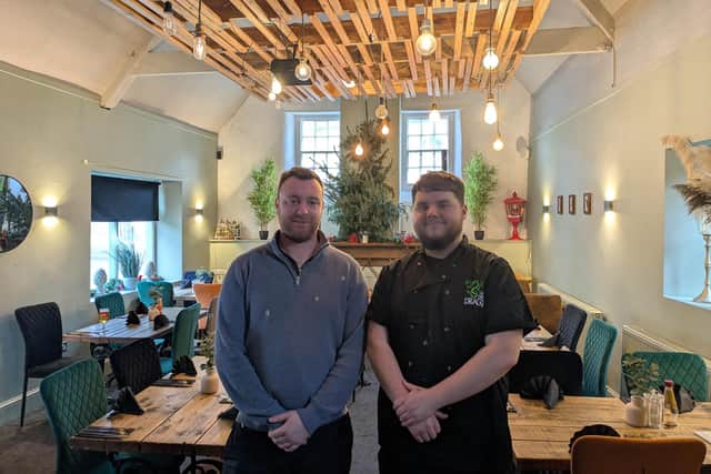 Kieron Phillips (left) took over the running of The Green Dragon in 2022, pictured with his head chef, Dylan Shepherd