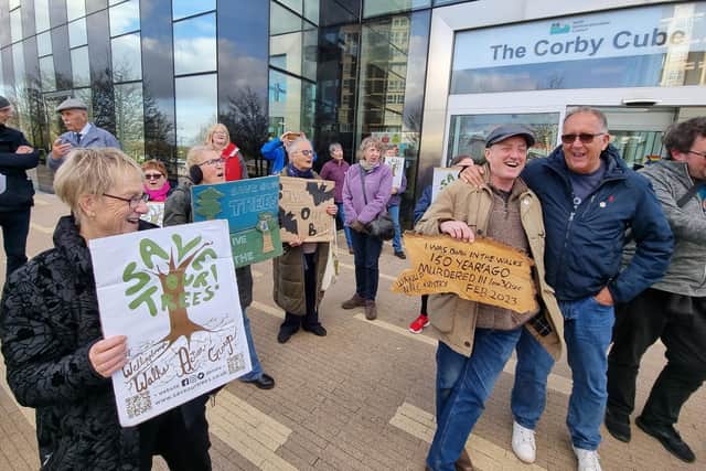 Campaigners from  The Wellingborough Walks Action Group outside The Corby Cube before last night's full council meeting