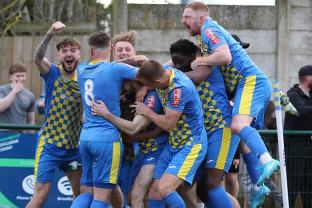 The Wellingborough Town players show their delight after Tom Iaciofano's last-gasp winner against AFC Rushden & Diamonds (Picture: Rib Wobb)
