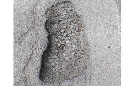 The pothole was one of many that have developed in the busy Kings Cliffe Road. Image: Submitted