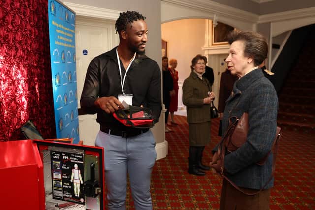 Princess Anne, Princess Royal is shown a emergency bleed control kit by Ravaun Jones of the knife crime community group Off The Streets.