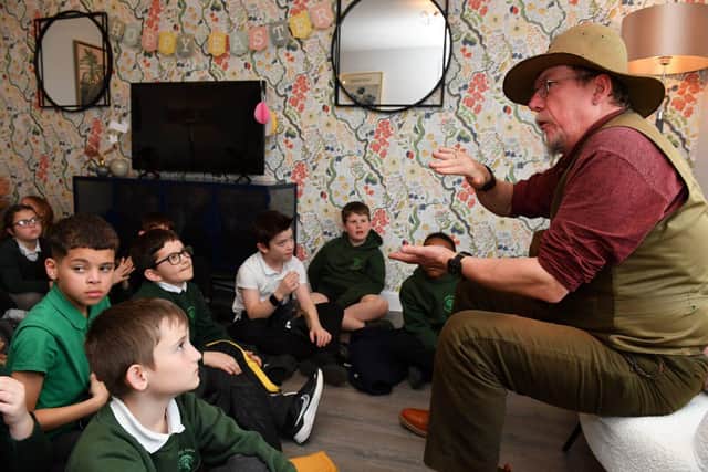 BN - AH - 25.03.2024-066 - A group of pupils listening intently to Mark Fraser