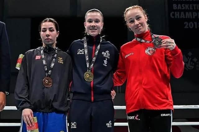 Lauren Mackie (centre) claimed a brilliant gold for Team GB in Sheffield