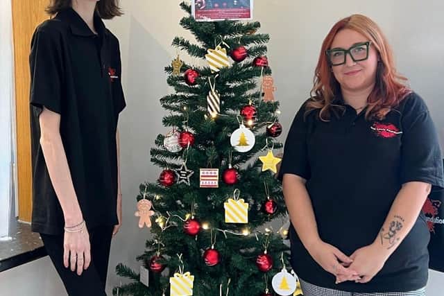 The Lewis Foundation's Dominique and Emily with one of the charity's Giving Trees.