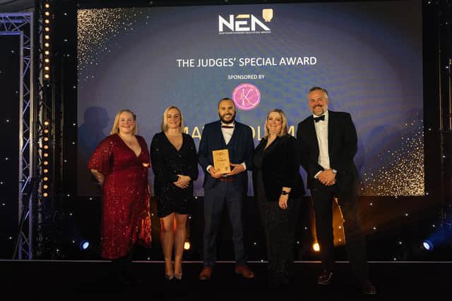 Matt Coleman receives his award from the NEA judging panel.