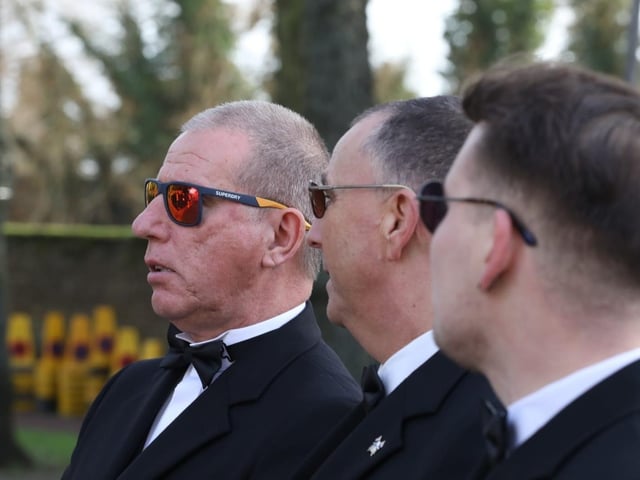 Mourners wore sunglasses