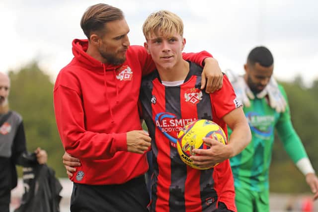 Lawson D'Ath congratulates hat-trick hero Eddie Panter after Monday's game (Picture: Peter Short)