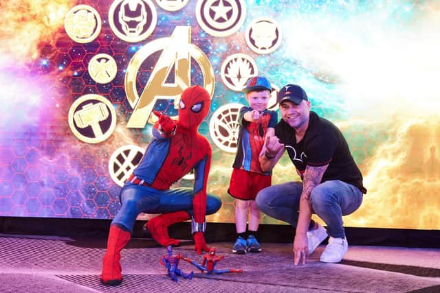 Fraser Hinde with dad Andrew and Spiderman - credit James Gillham