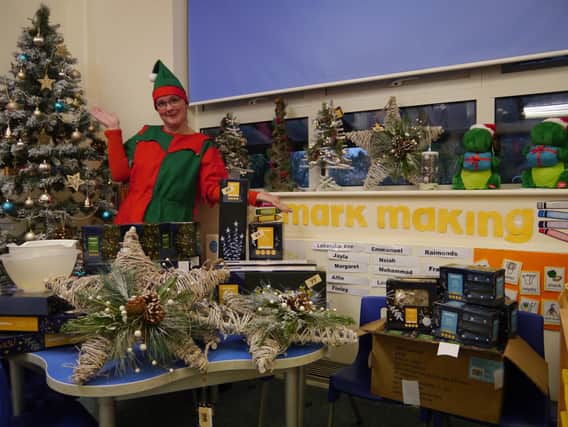 One of Santa's elves with the surplus stock