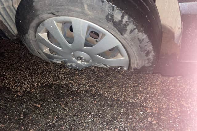 The van's tyre was wedged