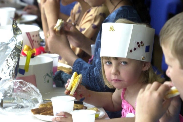 Children enjoy the Golden Jubilee Party at Newfield Green Tenants Hall, Sheffield on August 3, 2002. The picture shows Attia Rashid, aged 9, and Katie Kelly, 5