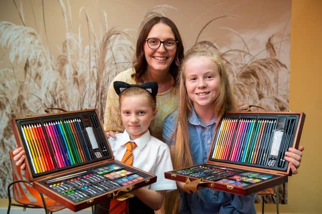 Creative Arts Lead Aimee Hindwood with competition winners Eden (L) and Alana