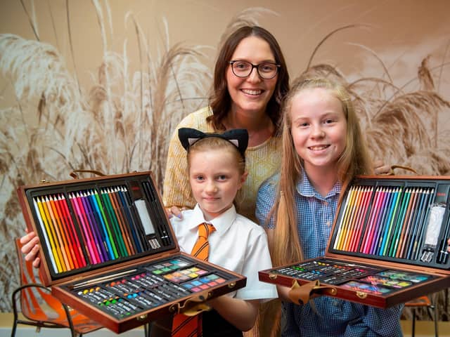 Creative Arts Lead Aimee Hindwood with competition winners Eden (L) and Alana